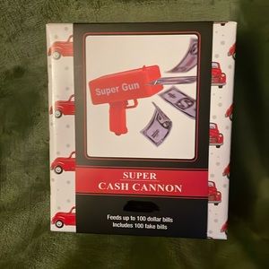 SUPER CASH CANNON: NIB, Feeds up to 100 dollar bills; includes 100 fake bills.
